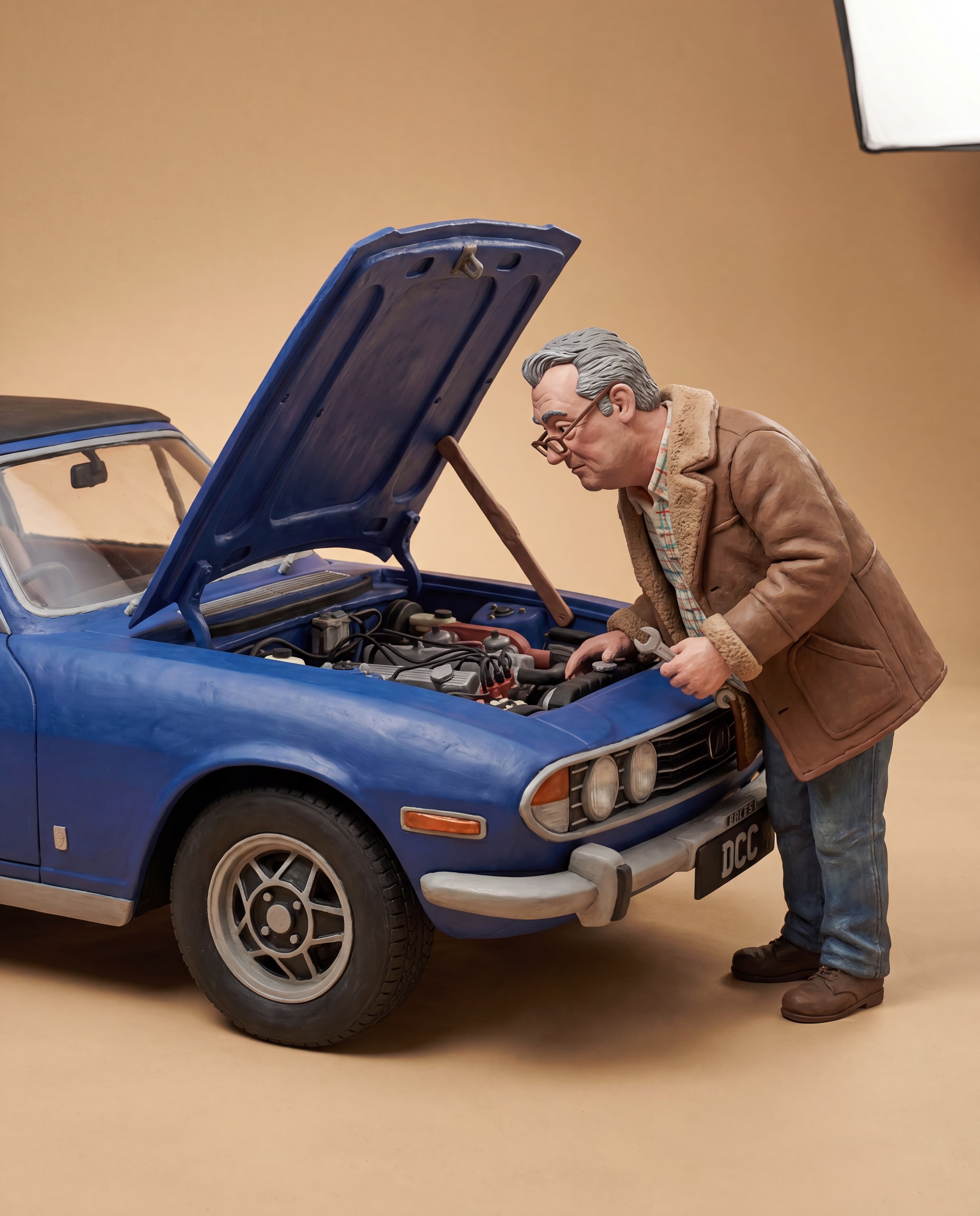 Dean working under the bonnet of a Triumph Stag claymation scene